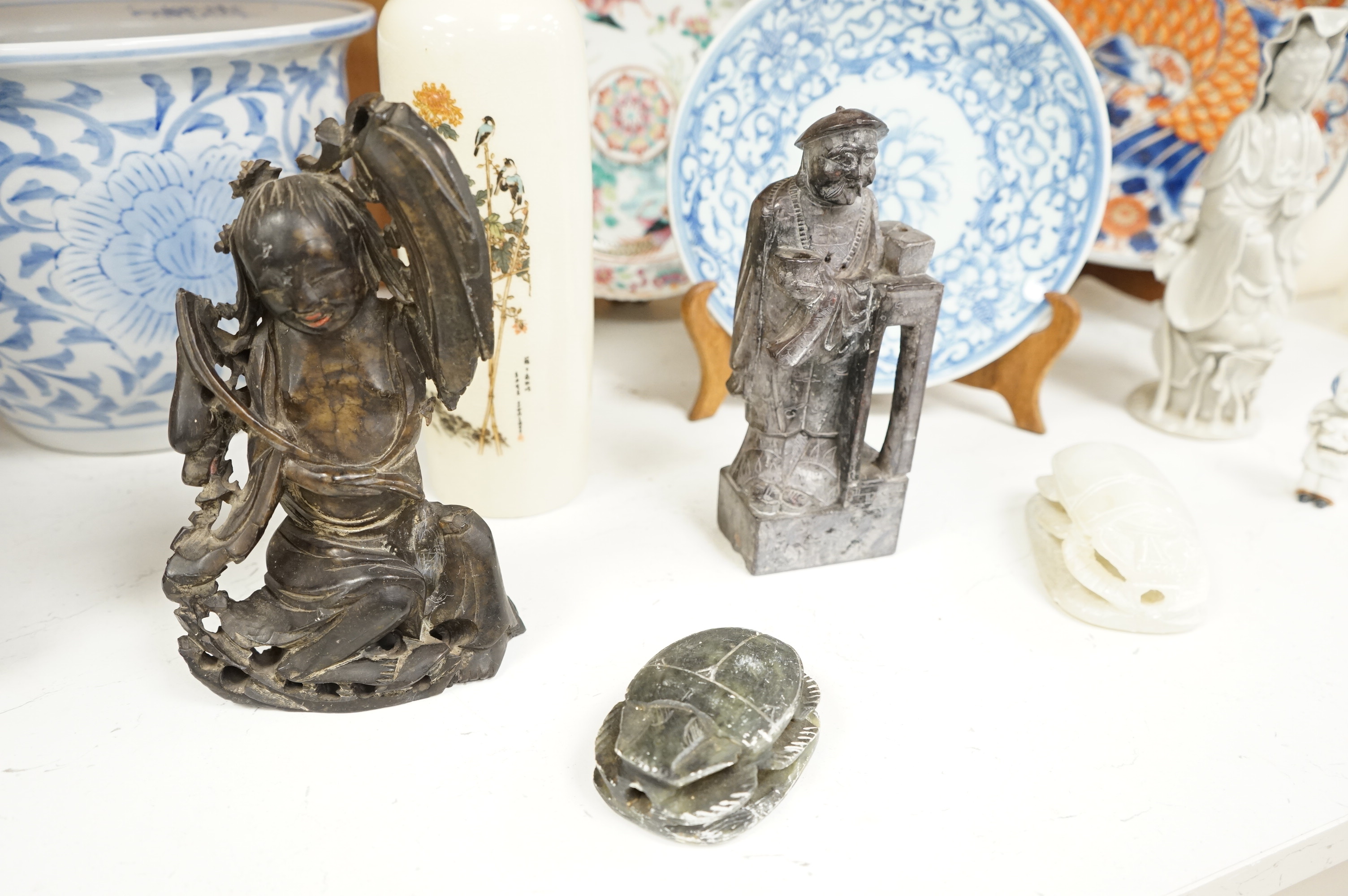 A large collection of various Chinese and Japanese ceramics and collectables to include a 19th century white glazed porcelain figure of Guanyin, largest 30.5cm